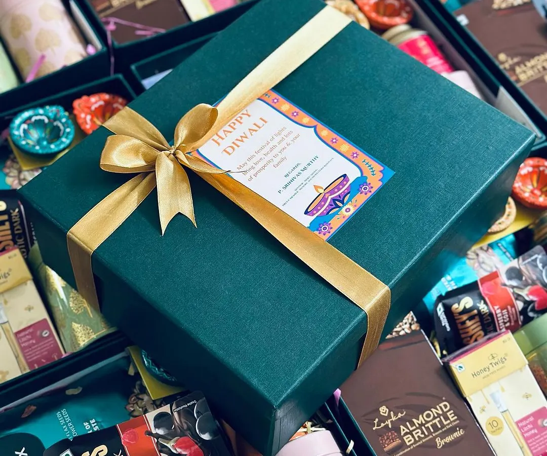 We specialize in creating premium corporate gifts that make a statement. This Diwali hamper, designed for a corporate client, features a sophisticated green and gold theme, filled with gourmet treats and festive essentials, ready for bulk delivery.