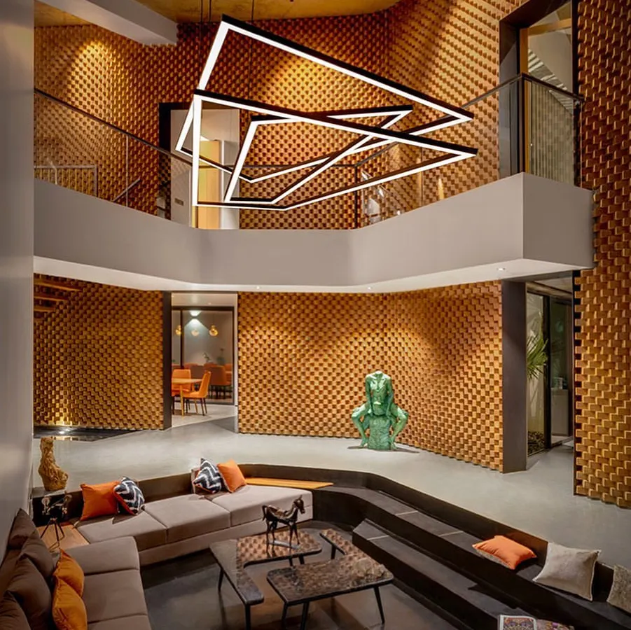 For the Sun House, we asked if a house could have emotions. The double-height living space, with its dramatic brick walls and sunken amphitheater seating, is our answer. It is a space designed to be powerful in its moods and imaginative in its form.