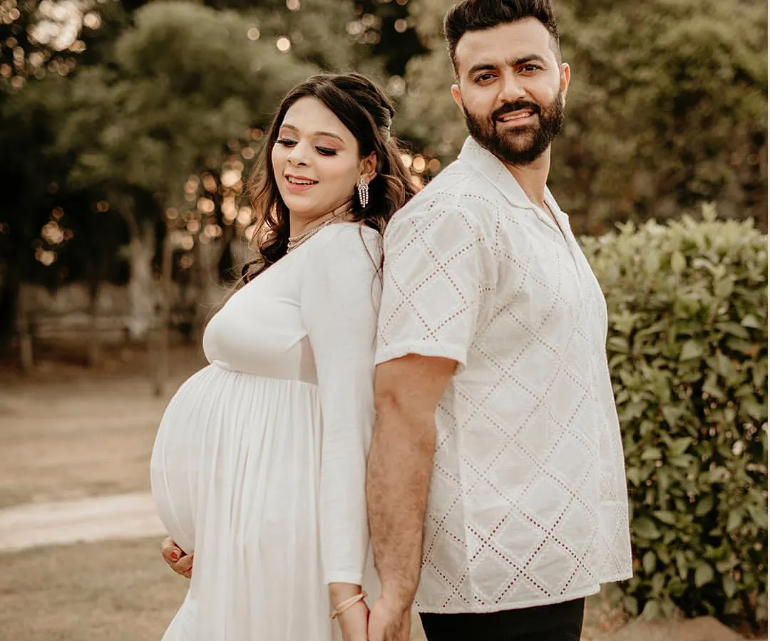 Capturing the quiet joy and connection between partners is one of my favorite things. This outdoor couple's portrait, shot in soft natural light, is all about the love and anticipation you share.