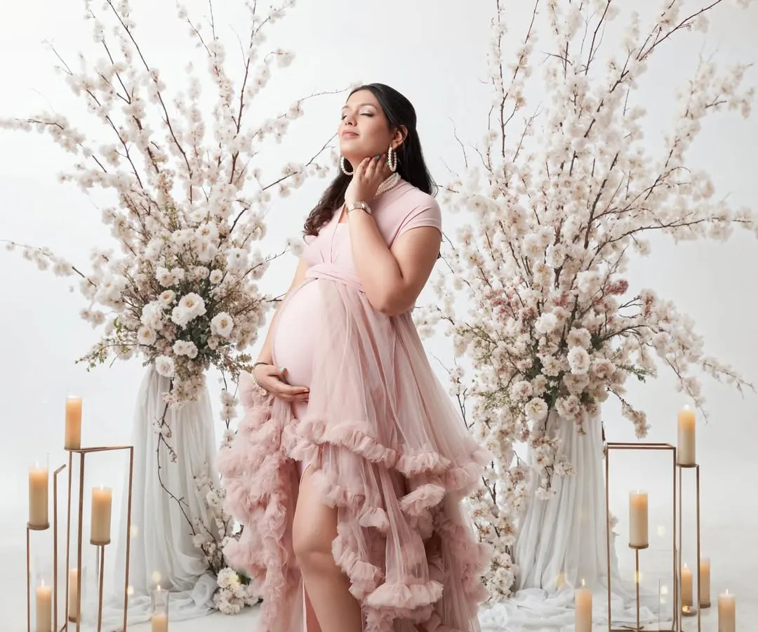 This is for the mom who wants a truly dreamy and elegant maternity session. We created a fairytale setting with flowing gowns, soft candlelight, and beautiful floral arrangements to celebrate her journey to motherhood.