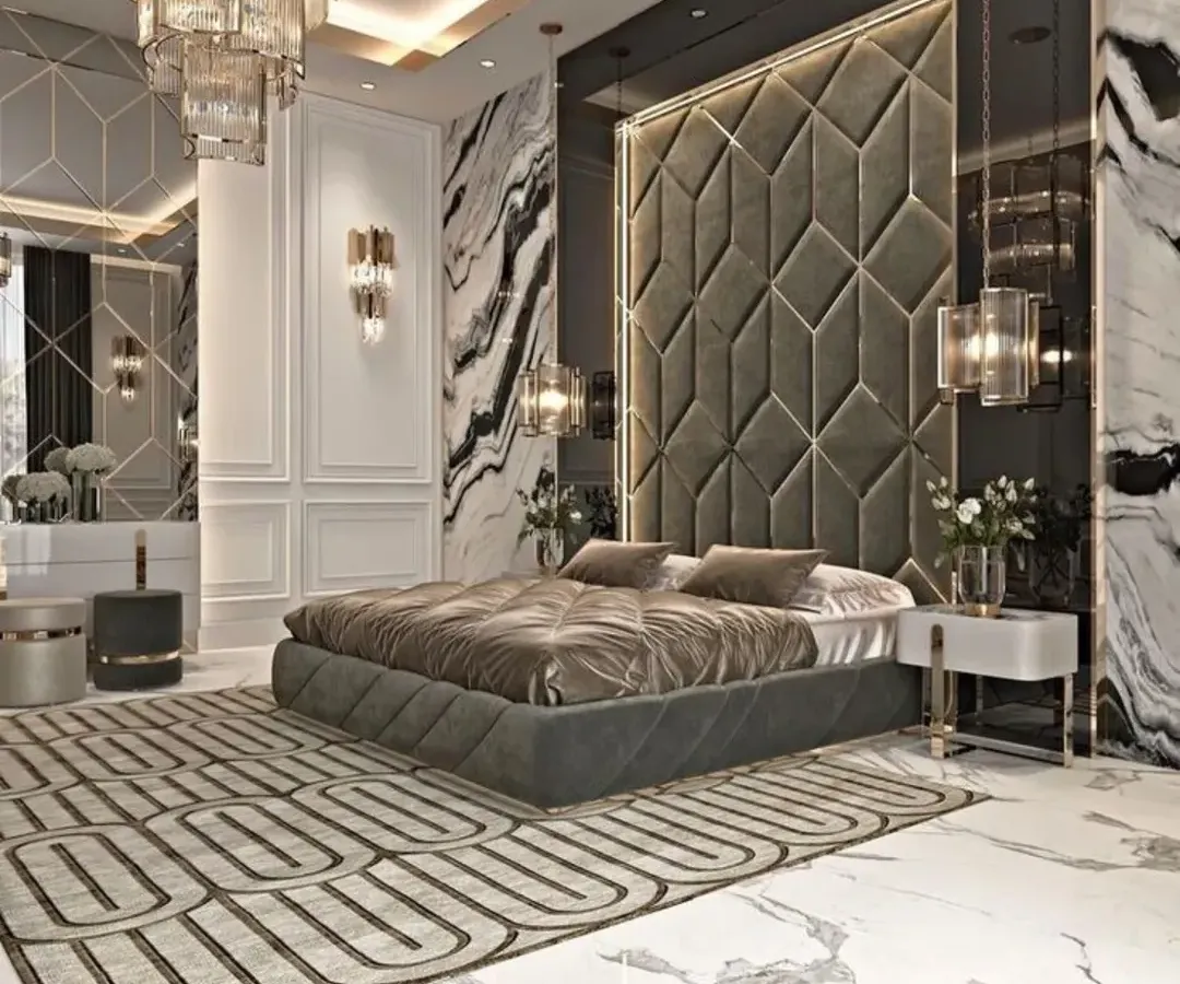 I design bedrooms that feel like a personal retreat. This master bedroom features a floor-to-ceiling upholstered headboard, dramatic marble walls, and a stunning crystal chandelier to create a truly opulent space.