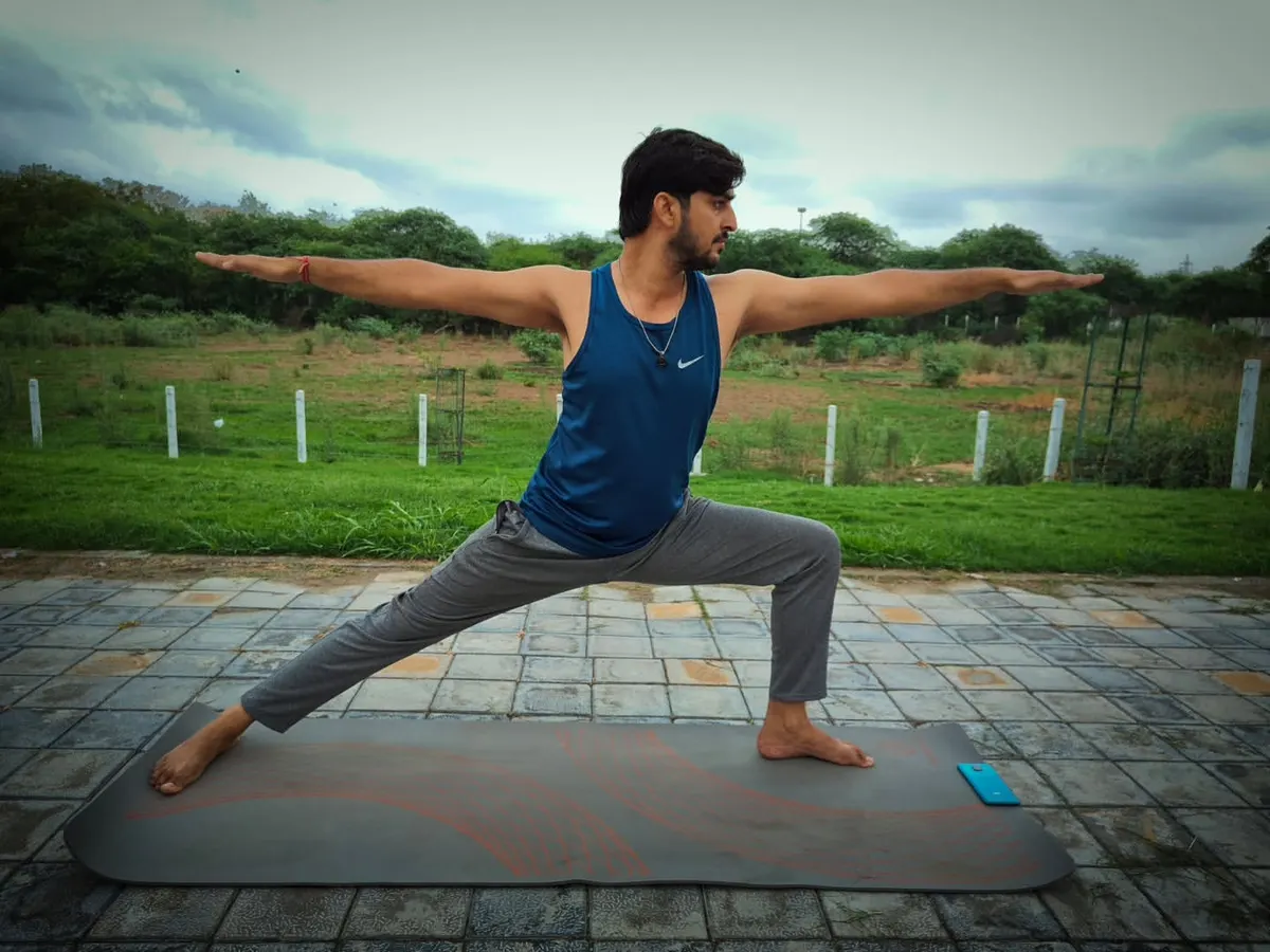 The Virabhadrasana 2, or Warrior Pose, is a fundamental asana for building strength and stability. I teach this to help you strengthen your leg muscles, improve focus, and challenge your body's balance.