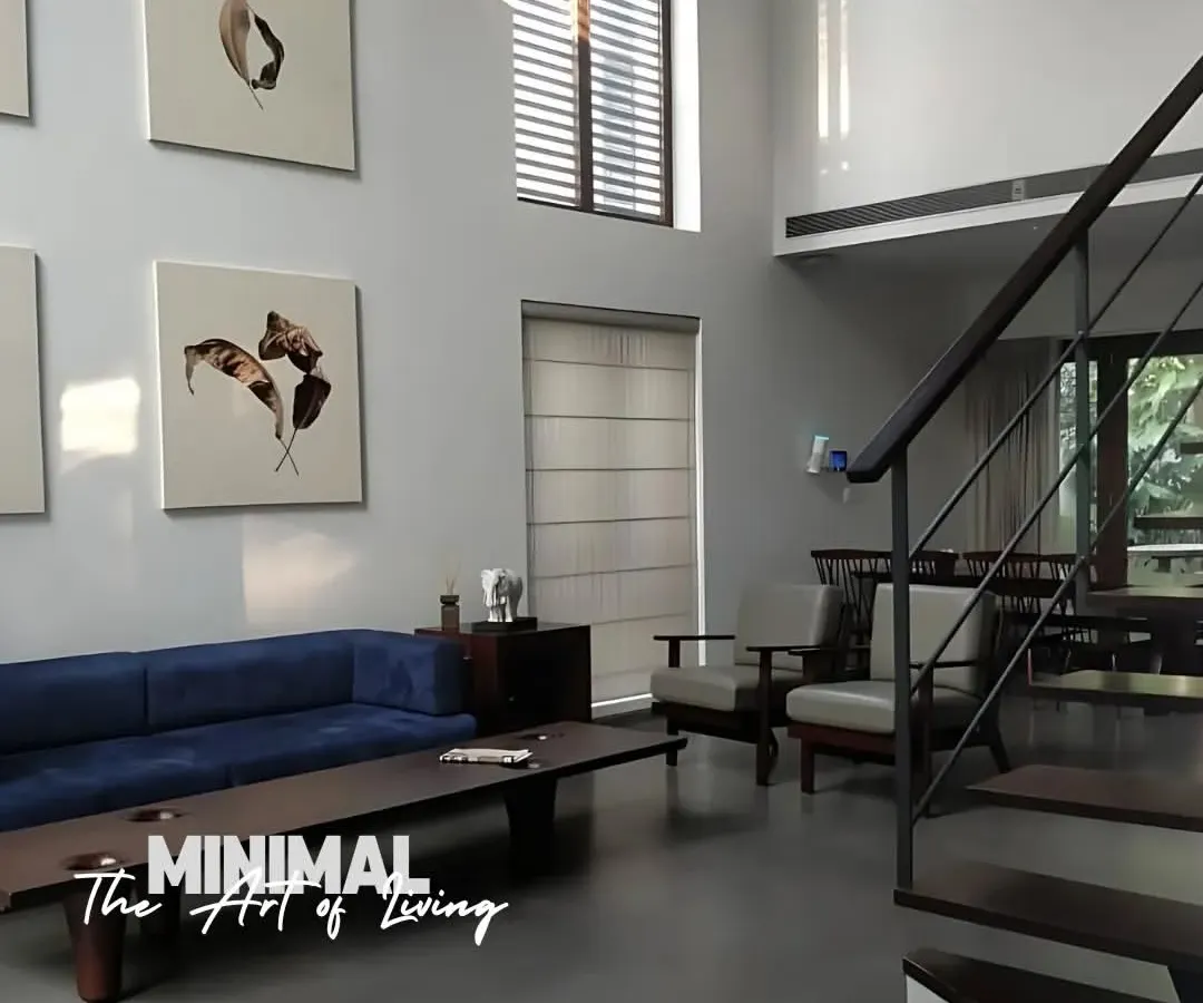 We believe minimalism is an art form. This double-height living room uses clean lines, natural light, and a curated selection of furniture to create a space that feels both grand and calming.
