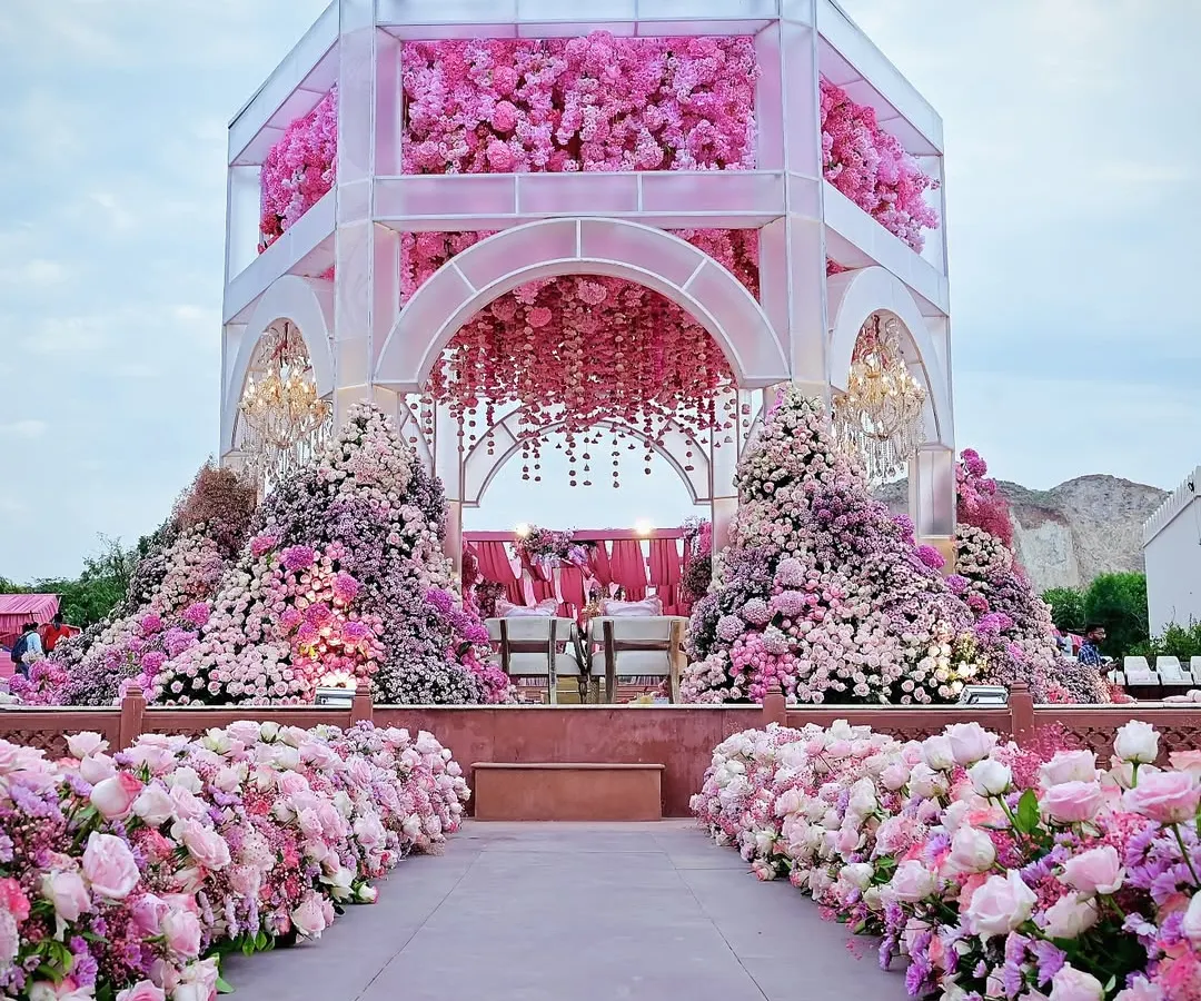 For this ceremony, I envisioned a modern mandap completely enveloped in a symphony of pinks. The structure is a floral masterpiece, with thousands of blooms creating a breathtaking oasis of romance and grandeur.