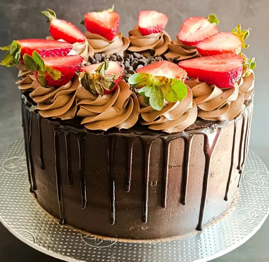 You can never go wrong with a classic. My Death by Chocolate cake is pure indulgence, with a rich, moist chocolate sponge, silky ganache, a dramatic drip effect, and topped with fresh strawberries.