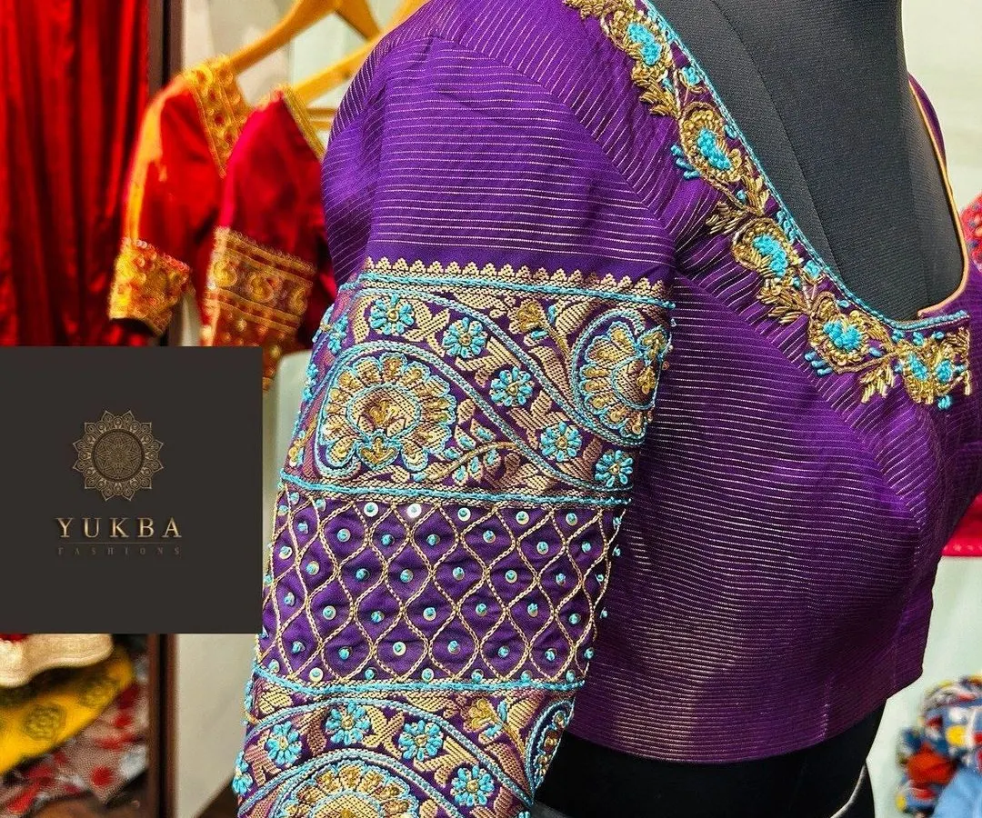 This is where my passion for detail comes to life. A custom bridal blouse in a rich purple, featuring intricate zardosi and threadwork with pops of turquoise, designed to be the statement piece of a bridal ensemble.