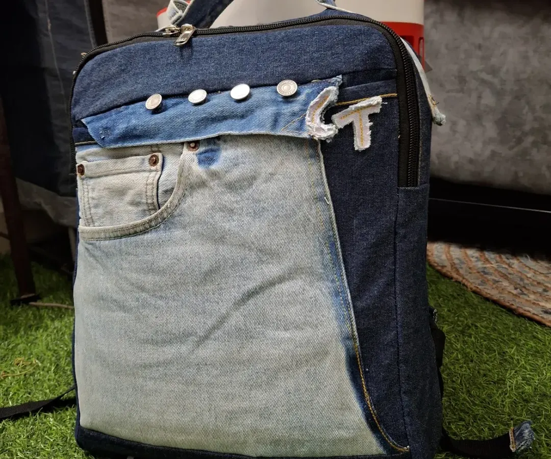 Don't throw away your old jeans. I can upcycle them into a durable and stylish backpack like this one. Notice how I've used the original pockets and waistband to create a functional and one-of-a-kind accessory.