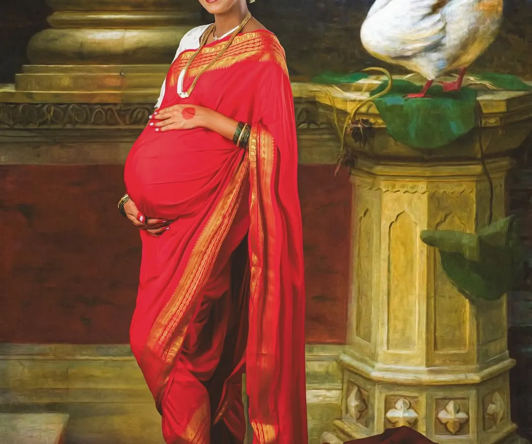 Inspired by the timeless art of Ravi Varma, this is a truly special traditional maternity portrait. We created a rich, painterly look to celebrate motherhood with classic Indian elegance in a red saree.