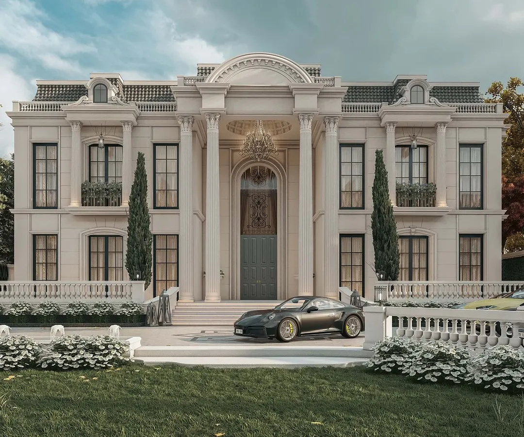We envision and craft palatial estates that are a testament to timeless European classical design, reimagined for the present day. This render showcases the grandeur we bring to life, with Corinthian columns, an ivory-toned facade, and a scale that speaks of royalty and magnificence, all while being nestled in lush, manicured greenery.