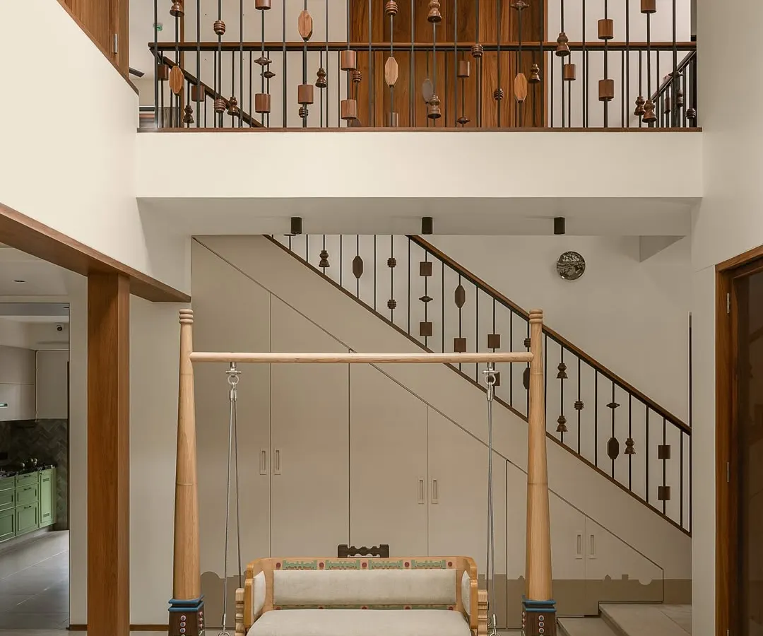 For our Kolam Pop project, we brought traditional South Indian aesthetics into a modern Mumbai home. The central courtyard features a custom-designed Oonjal, or swing, turning a simple transitional space into the heart of the home, perfect for family connection.