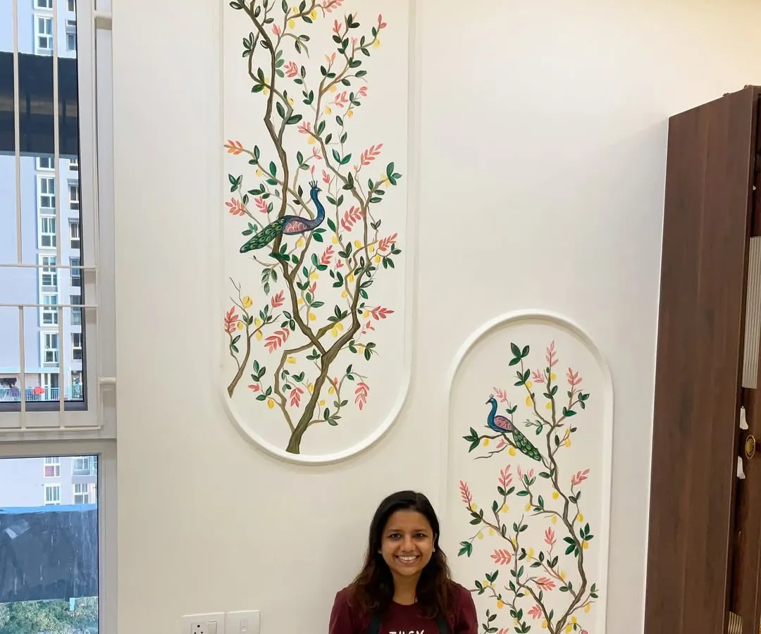 Standing proud with one of my favorite wall mural projects. This piece, featuring peacocks perched on delicate branches, was designed to bring a sense of serene nature into a double-height living space. I love creating large-scale art that completely transforms a room.