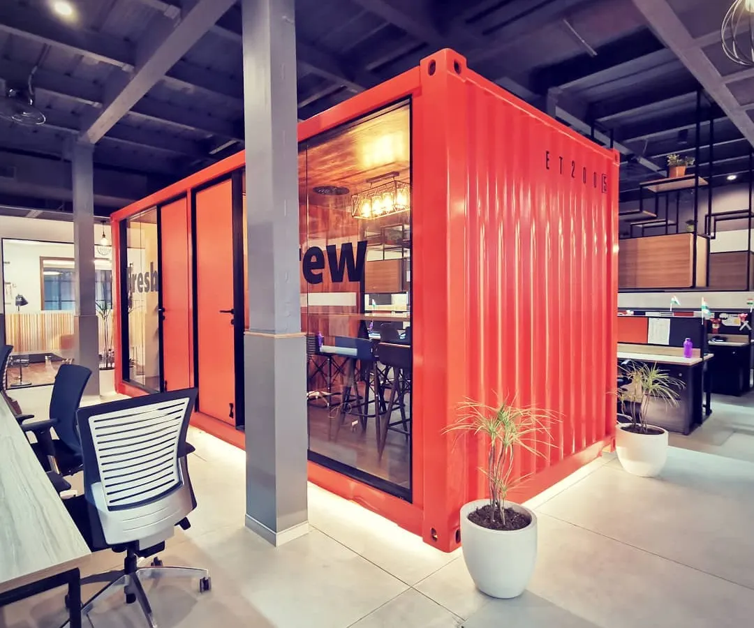 I believe in creating office spaces that boost productivity and reflect a modern work culture. For the Tata Hitachi dealership, I repurposed a shipping container into a vibrant, glass-walled meeting room, creating a unique and collaborative hub within the main office floor.