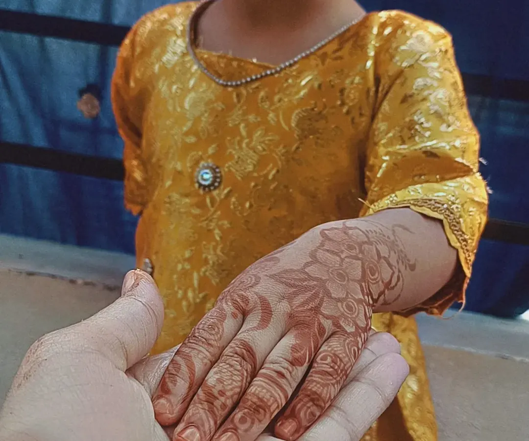 This photo shows the beautiful, rich brown stain my organic henna leaves after a day. I love this artistic shot holding my niece's hand, showing the lovely floral design that has fully developed. A great stain is a sign of pure, chemical-free henna.