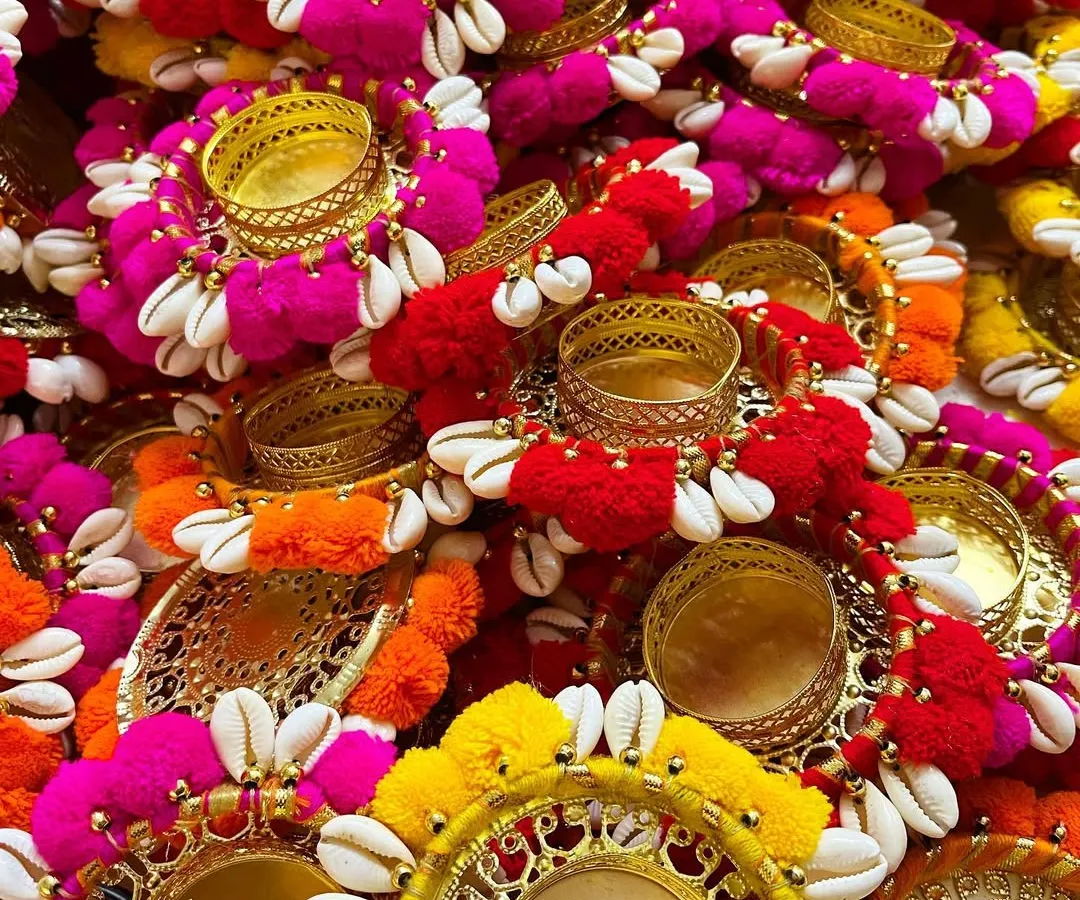 Just look at this burst of color! These are our new pompom and cowrie shell tea light holders, perfect for adding a festive glow to your home during Diwali, weddings, or any celebration. Each one is handcrafted with so much love.