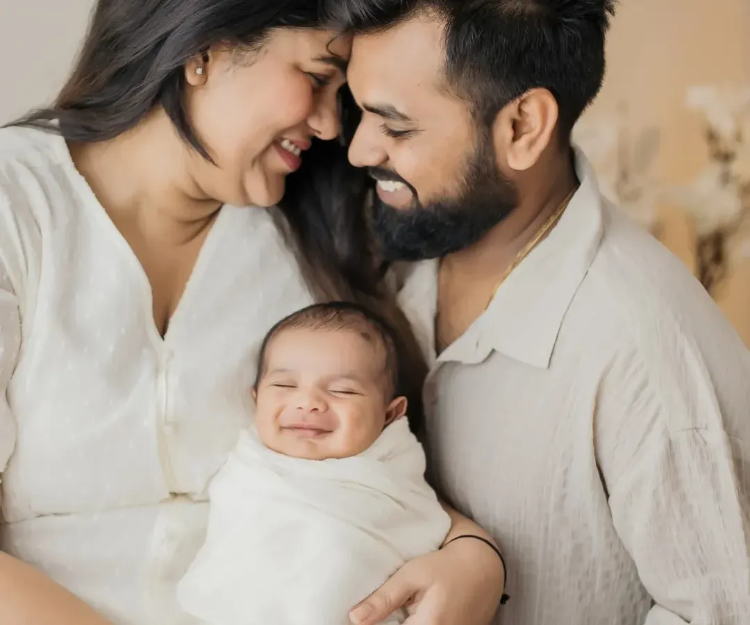 That first family photo with your newborn is pure magic. Look at that little smile! I focus on capturing the genuine love and happiness in these early days as you become a new family.