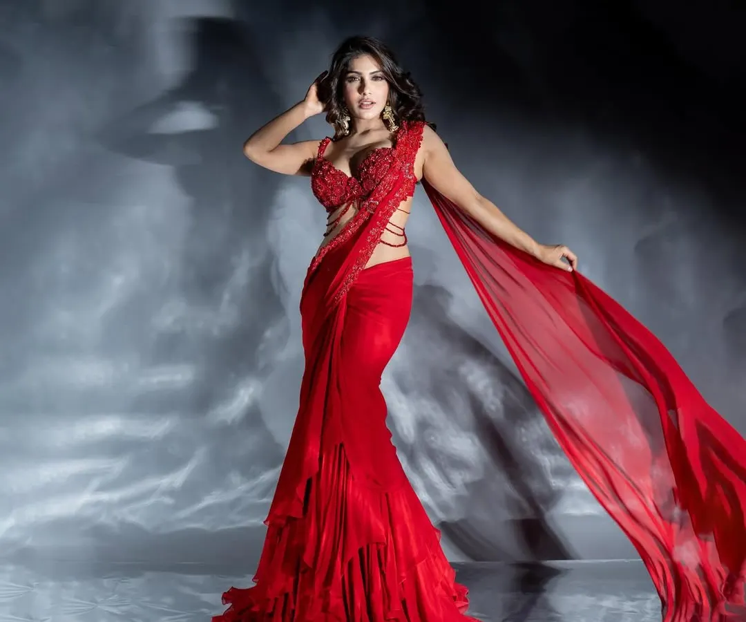 A dynamic studio shot of actress Ishita Raj in a flowing red gown. I used specific lighting techniques to capture the motion of the fabric and create a sense of energy, resulting in a powerful image for a fashion portfolio.