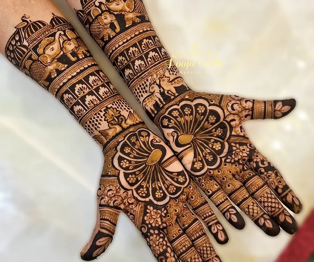 A design fit for the queen of the family. For the groom's mother, we created this regal, full-coverage henna featuring majestic peacocks on the palms and intricate bands of elephants and architectural patterns on the forearms.