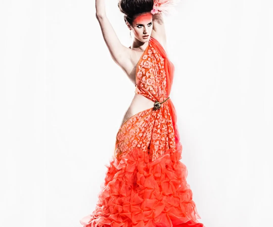 This look is one of my proudest creative achievements. Inspired by a flamingo, I draped unstitched fabric from Vandana Fabrics to create this entire gown without a single cut or stitch, showing how fabric itself can become high fashion.