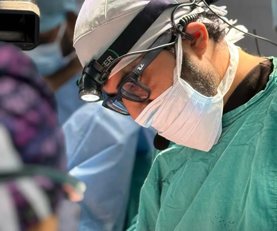 The level of focus and precision required for gender-affirming surgery is immense. Here, Dr. Kothari is performing a procedure during a specialized workshop, demonstrating the meticulous care we bring to every single hair follicle we transplant.