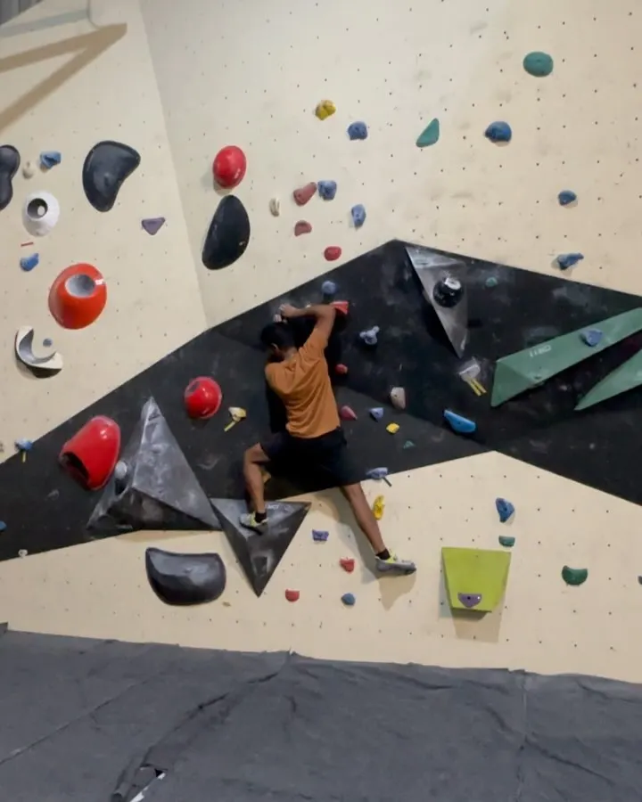 Here’s a climber getting focused on one of our routes. With a mix of holds and wall angles, you can always find a new bouldering problem to challenge your technique and strength.
