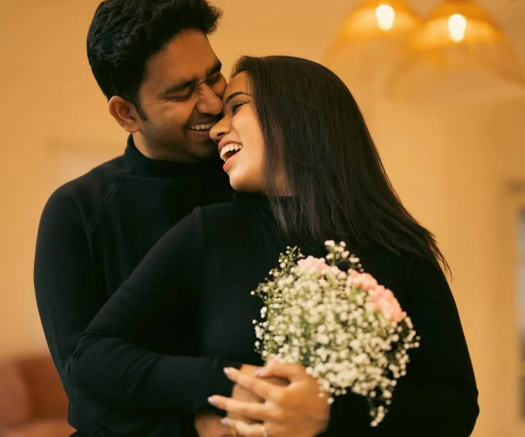 In our Bangalore studio, we create a relaxed space where you can just be yourselves. This candid shot, full of laughter and warmth, is a perfect example of how we capture your natural connection without any awkward posing.