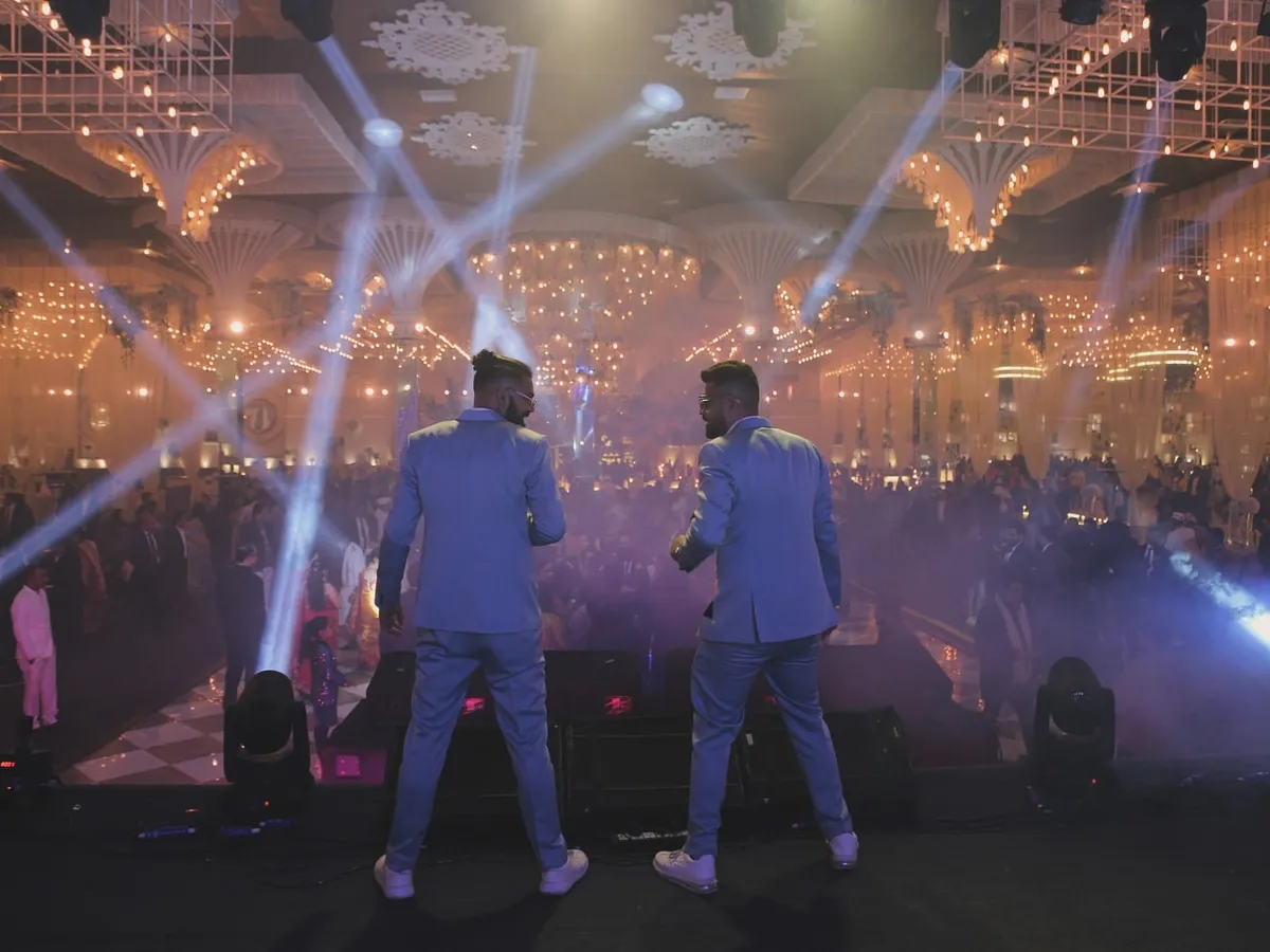 Facing a sea of happy faces is what we live for. This shot captures the moment we connect with the crowd, turning a beautiful wedding reception into a full-blown concert experience with epic lighting and sound.