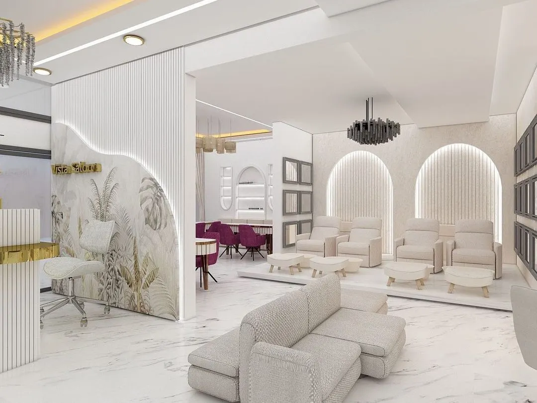 We deliver a high-end salon experience. This is a look at the quality of the interior design and layout you will receive, featuring a spacious reception, comfortable pedicure stations, and a modern aesthetic.