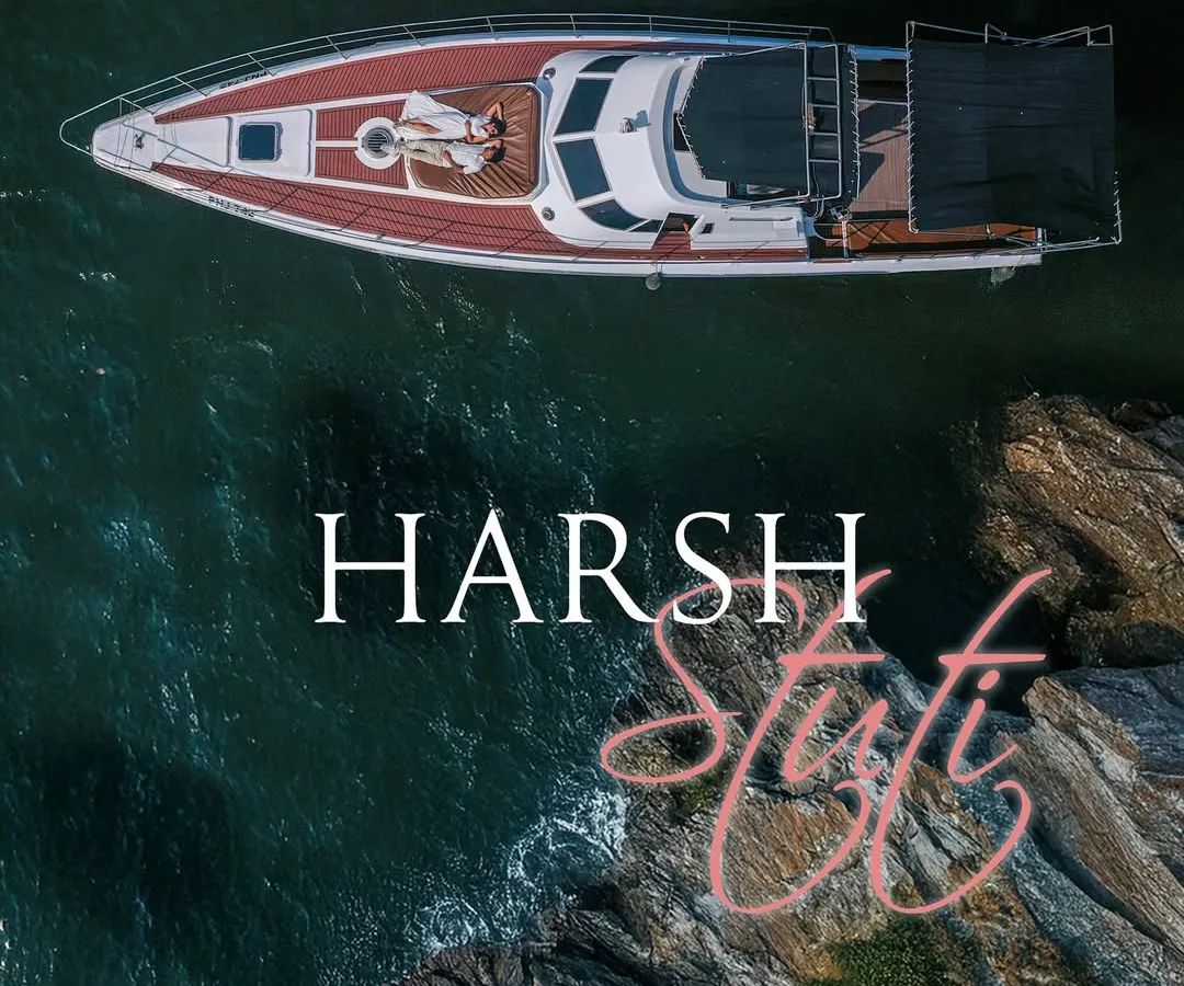 An aerial drone shot captures a couple relaxing on the bow of a yacht in the serene blue waters of Goa. This highlights my destination photography services, creating luxurious and cinematic memories wherever your story takes you.