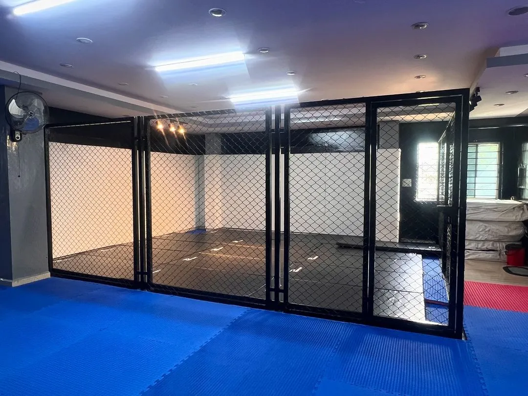Welcome to the cage at our HSR Layout dojo. This is where you'll test your limits, spar with champions, and get the real fight feel. It's not a regular gym; it's a professional training ground.