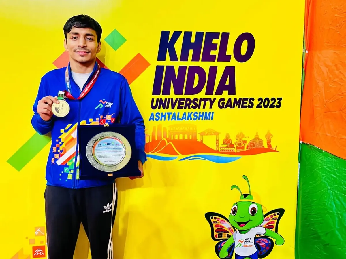 The result of dedication. Our boxer, Krishan Thakran, proudly displays his Gold Medal and plaque after winning the Khelo India University Games 2023.