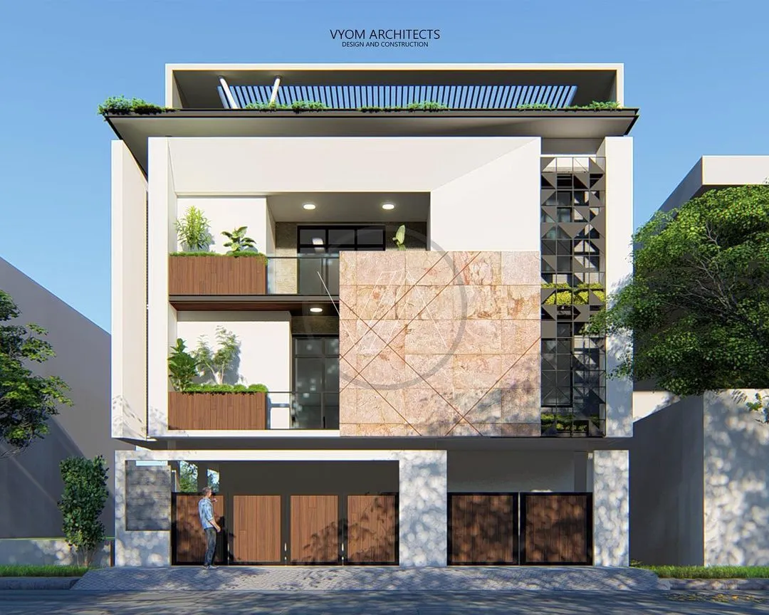 For this Bangalore residence, I kept it simple and clean. The facade design combines natural stone, wood-paneled planters, and a geometric jalli screen to create a play of textures and shadows, resulting in a modern home with a calm, inviting presence.
