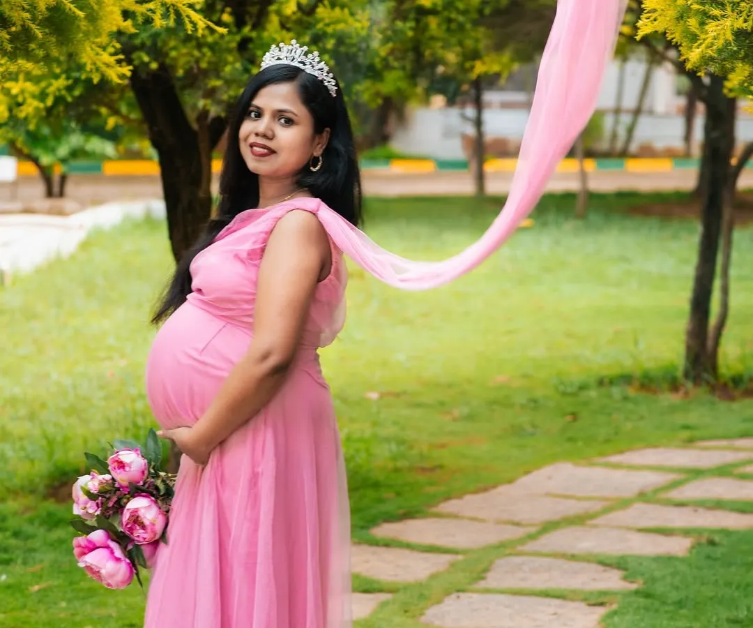 This is your fairytale moment. For this outdoor maternity session, we used a beautiful pink gown and flowing fabric to create a dreamy, ethereal portrait that celebrates the magic of motherhood.