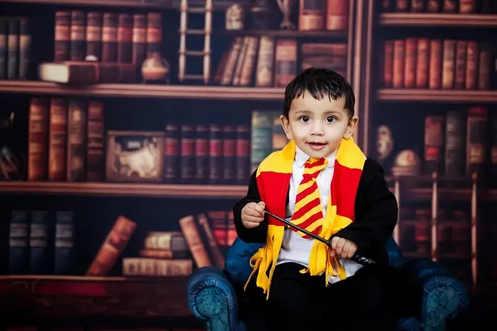 For the little wizards and witches, I bring the magic of Hogwarts to life. This Harry Potter themed shoot is one of my most requested setups, complete with a Gryffindor scarf, a magic wand, and a library backdrop for a truly enchanting portrait.