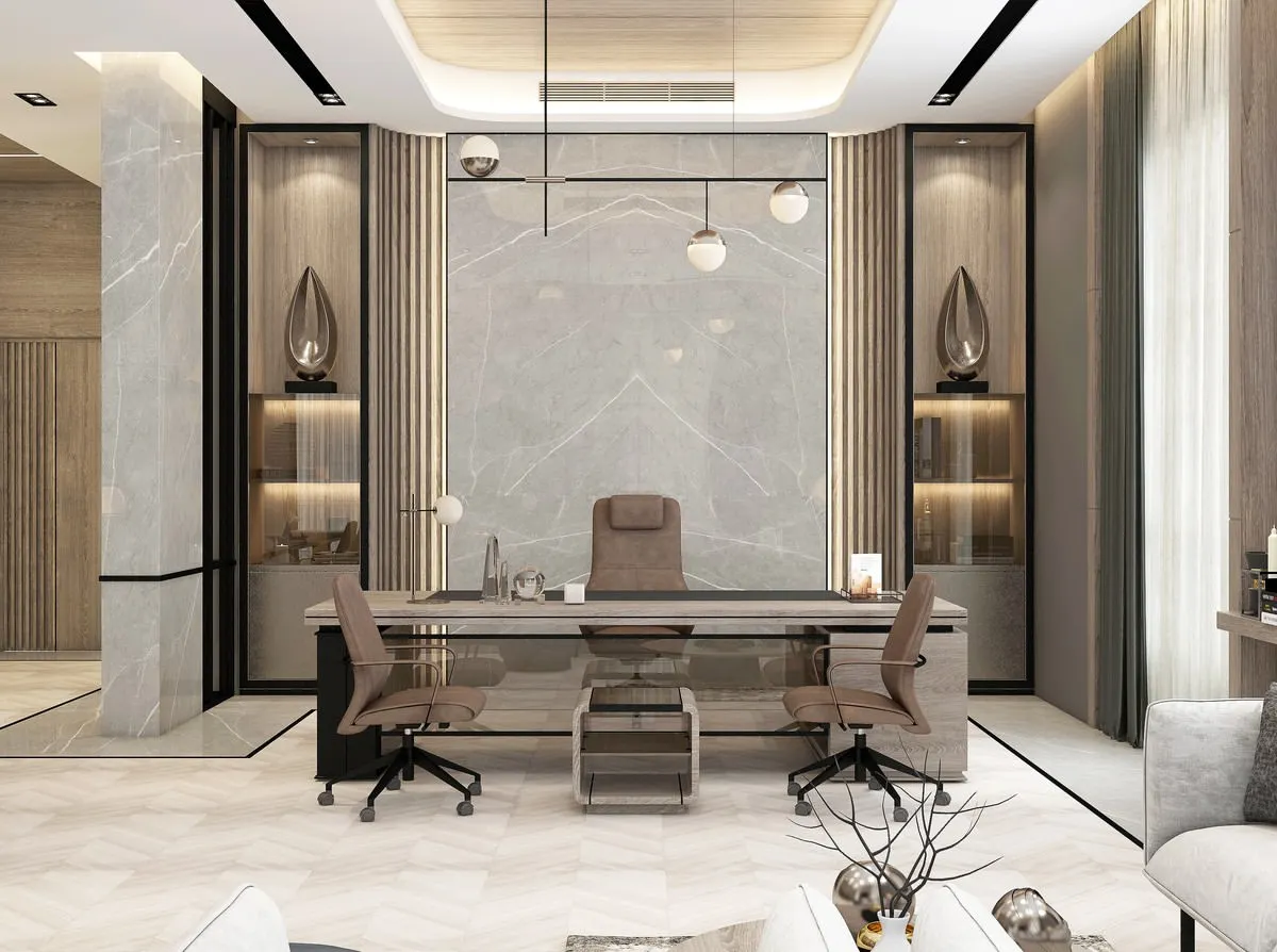 We design executive office spaces that command respect and foster productivity. This director's cabin features a balanced composition of marble, wood paneling, and ambient lighting, creating an environment of authority and refined taste for corporate leaders.