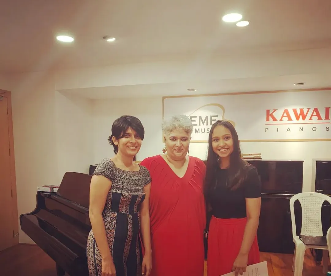 This picture is with my teacher, who helped me when I was struggling with my own voice and confidence. My coaching is built on this experience. I understand the self-doubt that can hold you back, and I create a space where it's safe to be vulnerable, to stumble, and to grow without judgment.