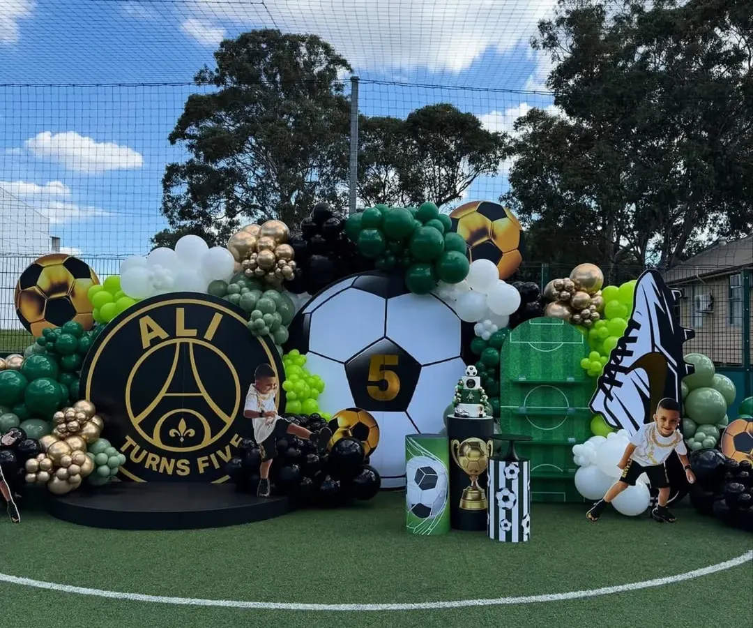 GOAL! For the little sports star in your family, we create action-packed themes like this football party. We transformed an entire field with custom backdrops, balloon arrangements, and themed props for a truly immersive experience.