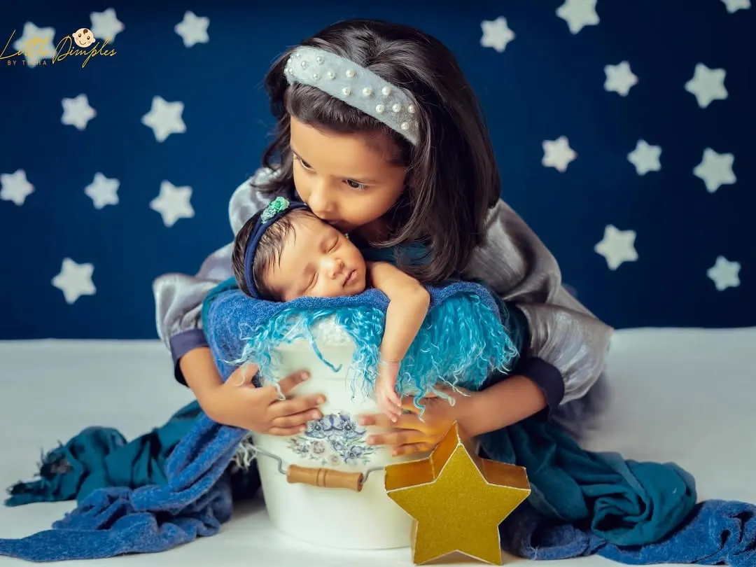 There is nothing more precious than the bond between siblings. I always make time in my sessions to capture these first gentle cuddles, creating a beautiful record of your growing family's love story.