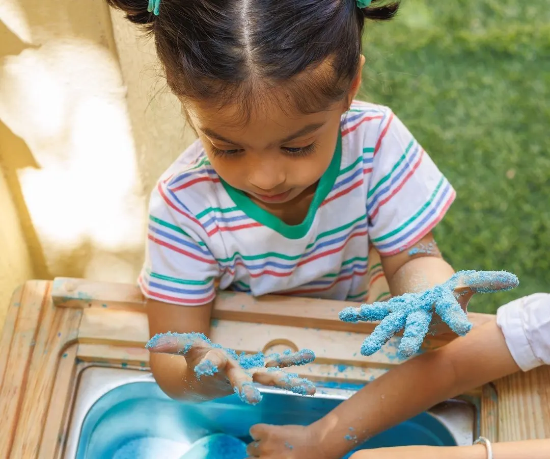 This is the look of pure, uninhibited joy. Our sensory play sessions encourage children to dive in, explore textures, and learn through touch. We handle all the setup and cleanup, so you and your child can focus on the wonderful, messy experience.