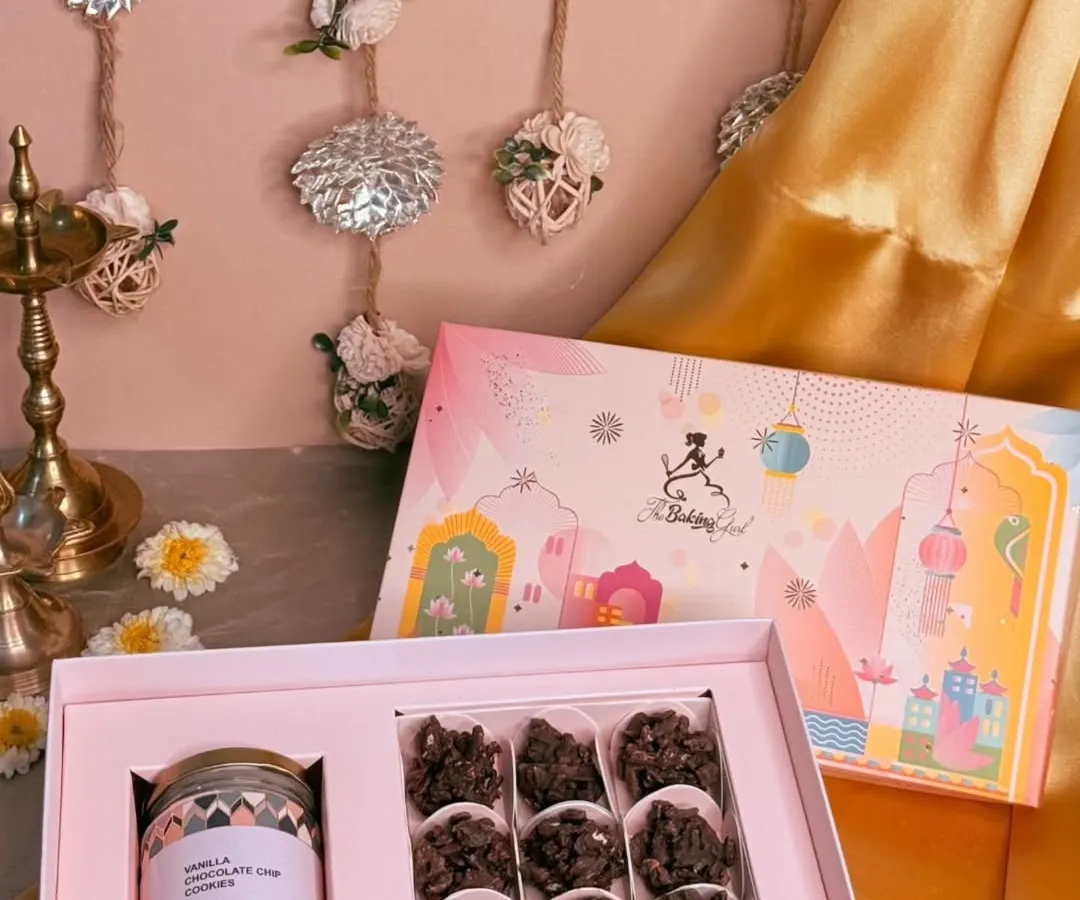 My Diwali hampers are designed to bring a sparkle to your celebrations. This beautiful box features crunchy Almond Rochers and a jar of my classic Vanilla Choco-chip Cookies, all packed in festive-themed packaging.
