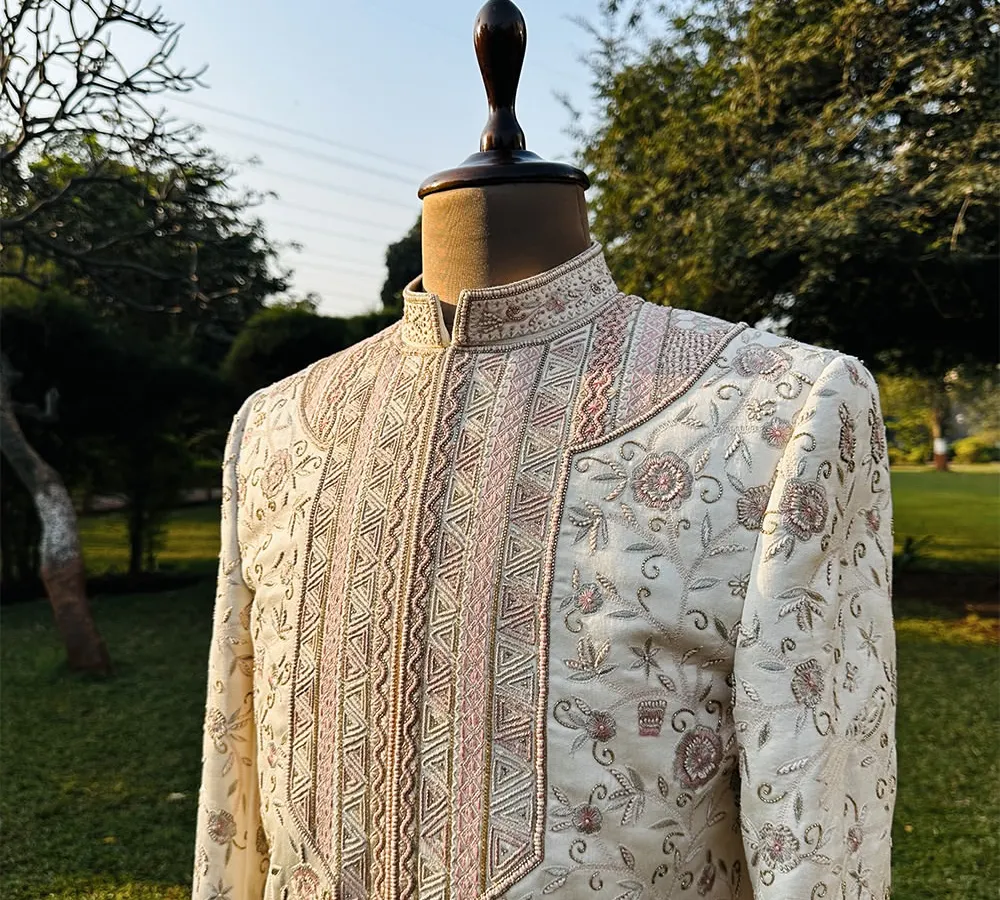 This is our Koyaliya Sherwani, a masterpiece crafted from luxurious, cruelty-free Ahimsa silk. Over 120 hours of intricate hand embroidery go into each piece, telling a story of artistry and timeless elegance.