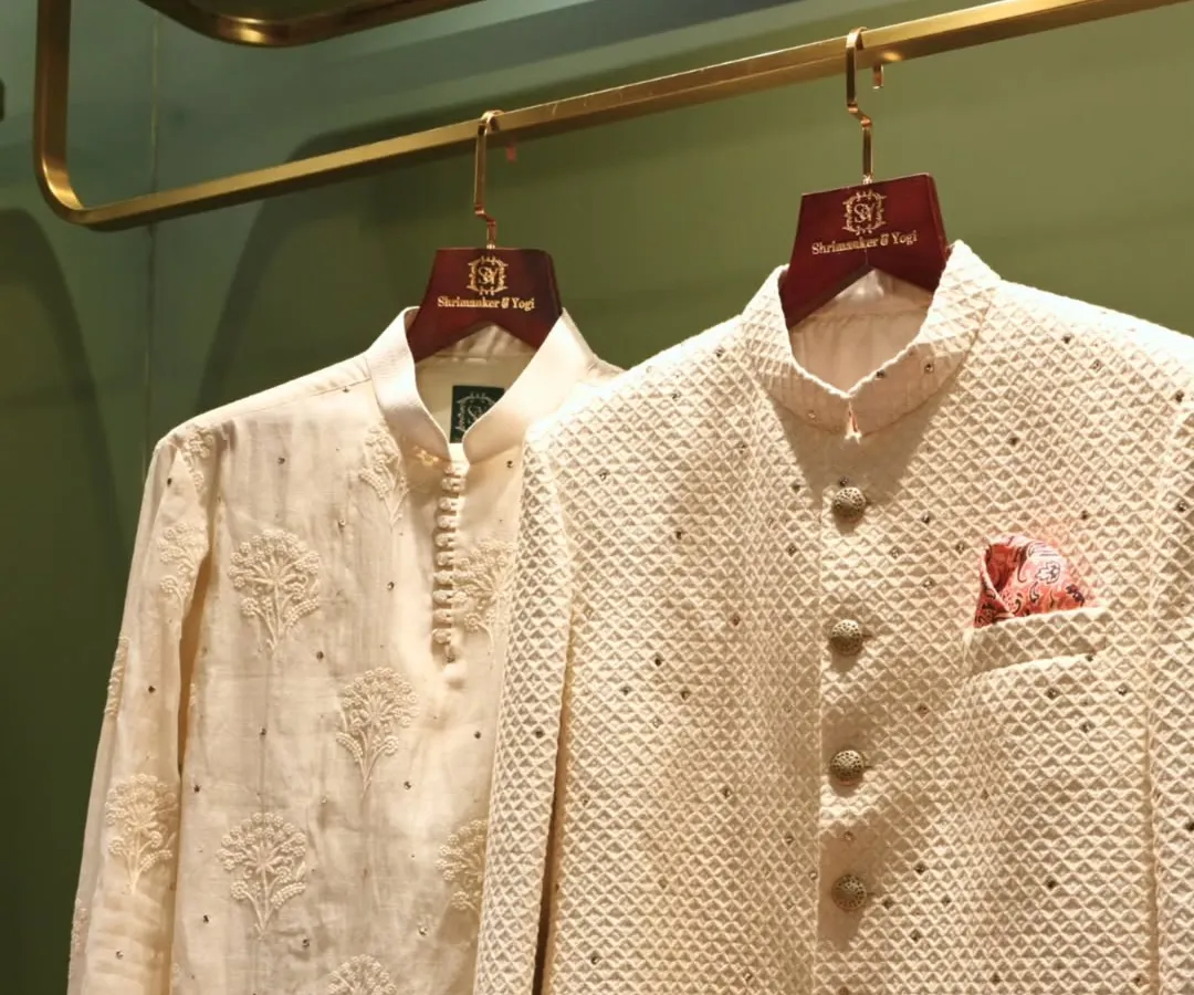 A classic pairing for any celebration. This look features a textured ivory bandhgala jacket with subtle embellishments and a fine kurta, showcasing our dedication to clean lines and understated elegance in groomswear.
