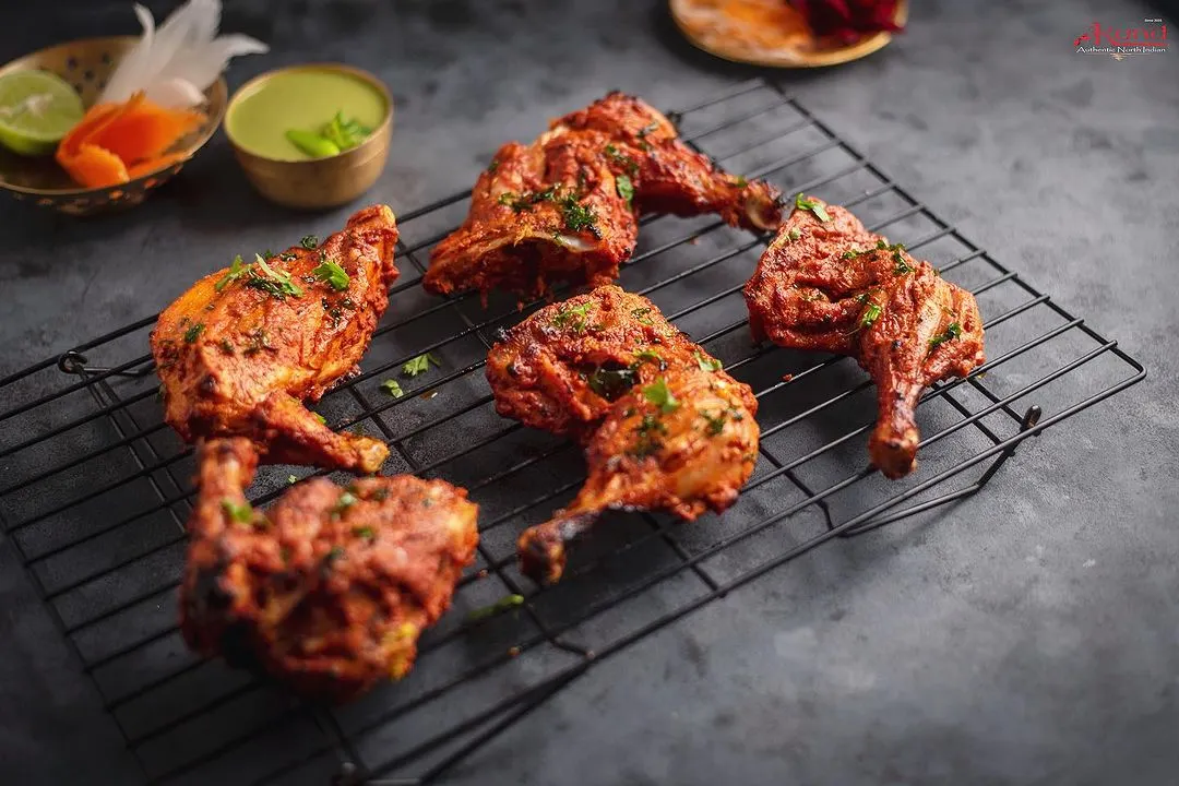 Our Tandoori Chicken is a classic for a reason. We marinate it for hours in our secret, 100-year-old spice mix and cook it in a traditional charcoal tandoor until it's smoky and perfectly juicy. This is the authentic North Indian barbeque taste we are famous for.
