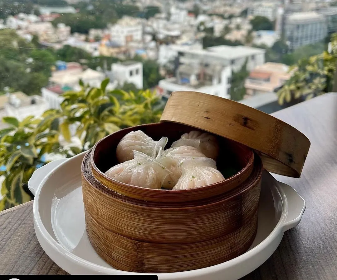 A guest favorite from our Pan-Asian brunch at Ging. These delicate shrimp dumplings are steamed perfectly and served with a stunning view of the Bangalore skyline, making for a picture perfect dining moment.