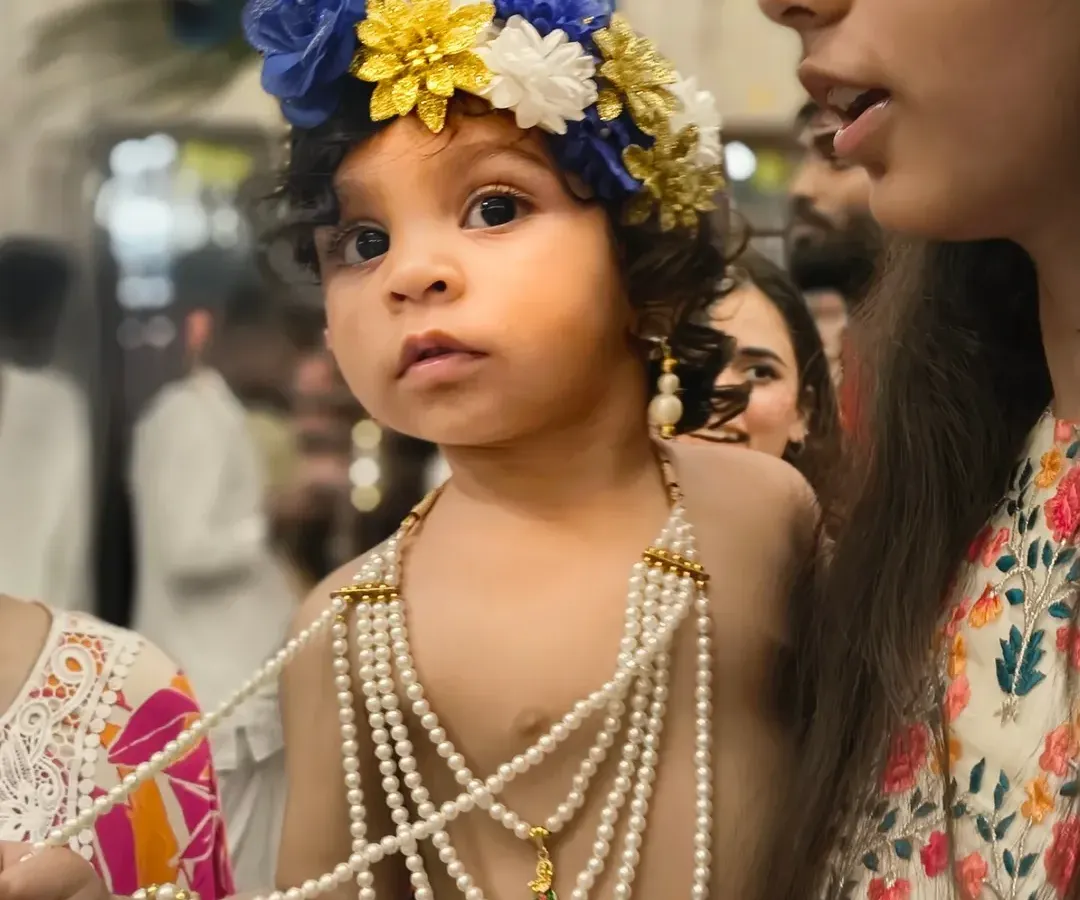 Capturing the pure innocence of a child dressed as Krishna for Janmashtami. My goal for kids' photography is to catch these genuine expressions, where the child is lost in their own world, making for truly authentic festival portraits.