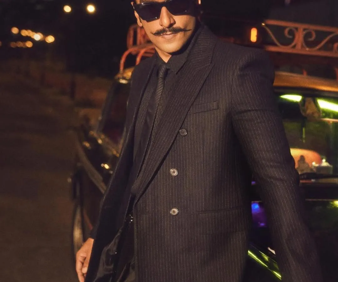 For the grand opening of Jio World Plaza, we created this sharp, all-black 'Desi Kalakar' look for Ranveer Singh. The styling combines a tailored Yves Saint Laurent suit with a contemporary draped silhouette by Manish Malhotra, creating a powerful statement in modern menswear.