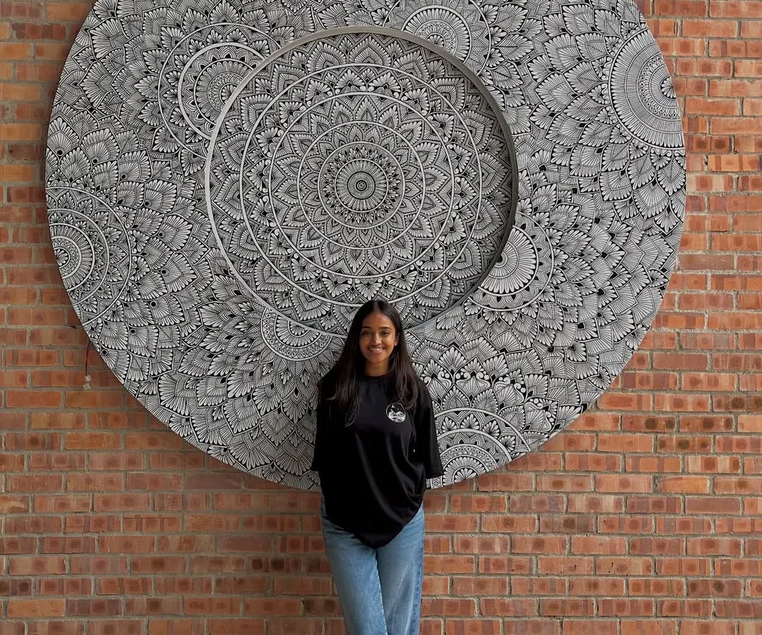 This is me with my first international mandala project in Malaysia. It’s a reminder that small, consistent steps fueled by passion can lead to the biggest dreams. This piece was created entirely on-site and is a huge piece of my heart.