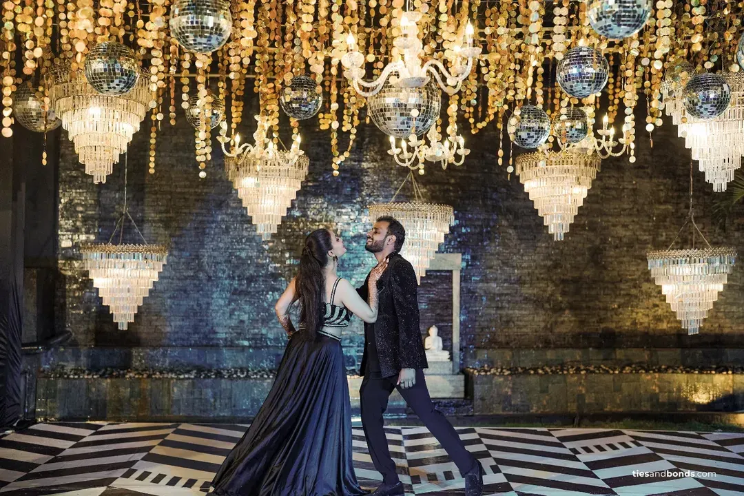 Under a ceiling of shimmering disco balls and crystal chandeliers, the couple shares their first dance. I design glamorous Sangeet and Cocktail nights that feel like a scene from a movie.