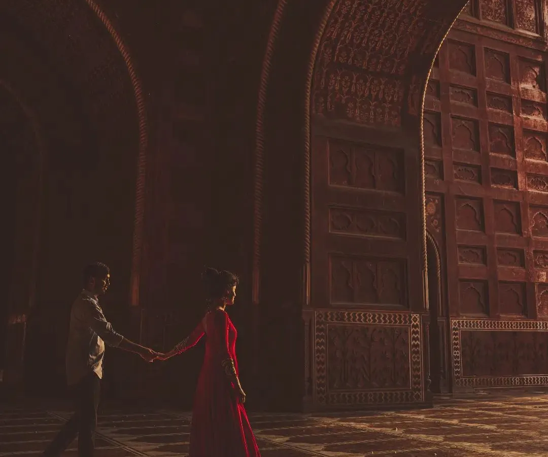Forget the typical tourist shots. I create moody, cinematic couple portraits like this one, using the shadows and arches of the Taj Mahal complex to tell a more intimate story.