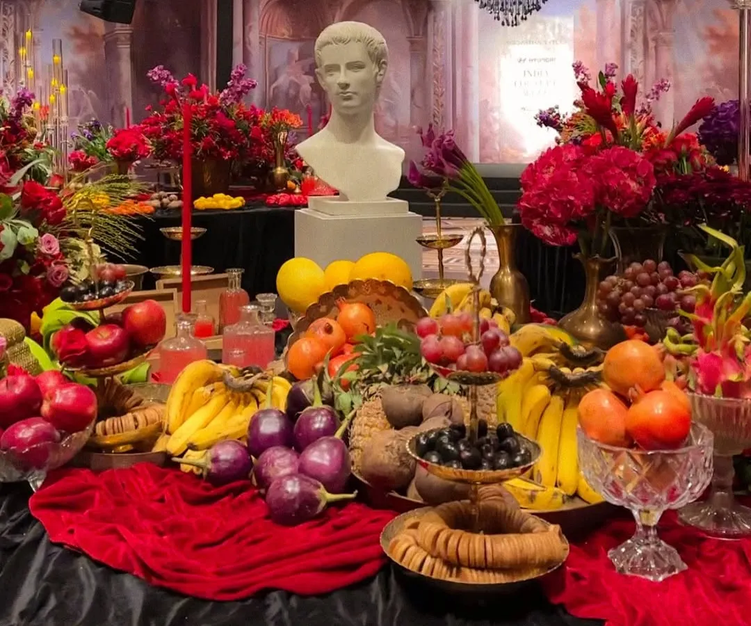This is a glimpse of the unapologetic extravagance I created for Siddartha Tytler's 'Caligula's Feast'. The runway was a dramatic banquet table laden with jewel-toned flowers, real fruits, and classical elements, building a world of decadent, sensory overload.