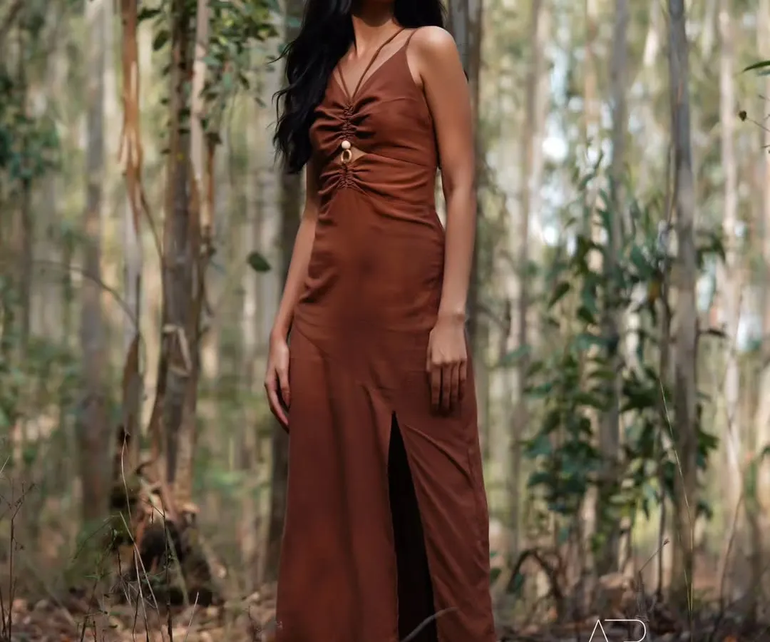 I love shooting outdoors where the environment becomes part of the story. This shot, taken deep in a forest, uses natural light and shadow to create a feeling of quiet intensity and connection with nature for this western wear lookbook.